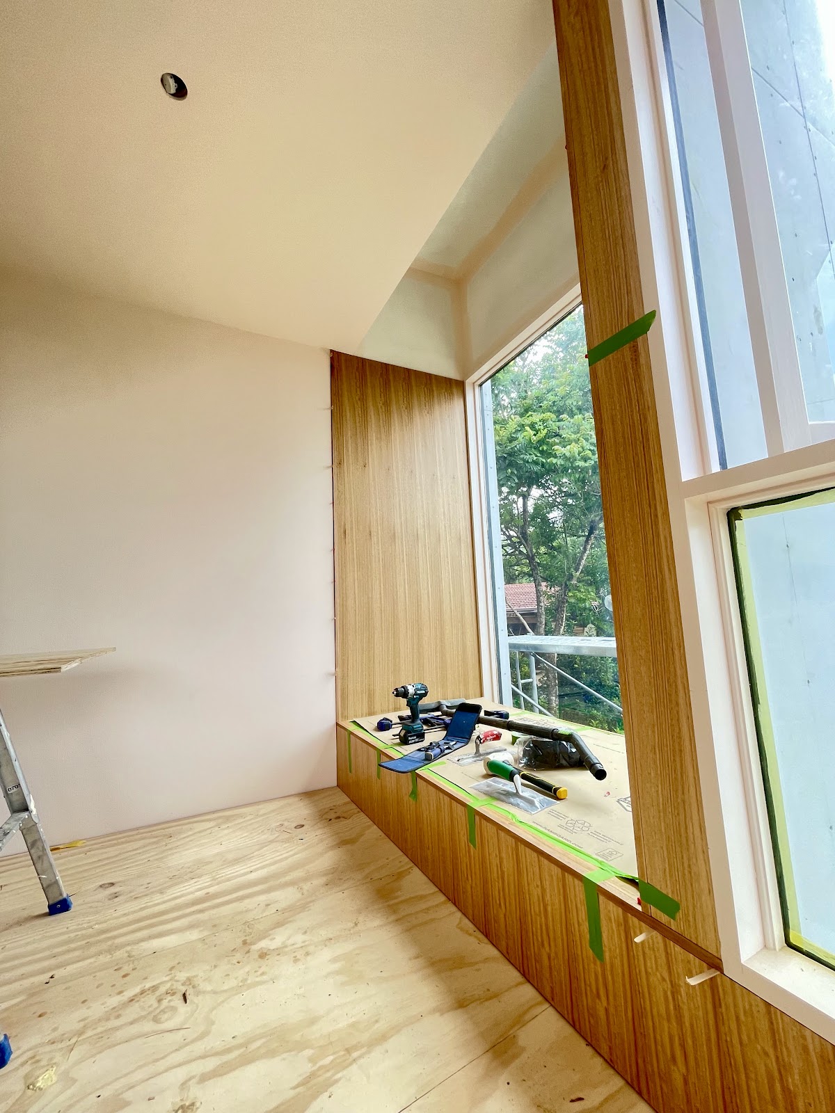 Timber window seat with new plasterboard lining above and around the window